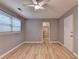 Bedroom featuring natural light, wood-look flooring, and a ceiling fan at 1094 Amber Sw Rdg, Lilburn, GA 30047