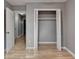 Bedroom with hardwood floors, closet and doors leading to other rooms at 1094 Amber Sw Rdg, Lilburn, GA 30047
