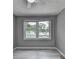 Bright bedroom with hardwood floors and large window at 1094 Amber Sw Rdg, Lilburn, GA 30047