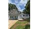 Charming two-story home with neutral siding and modern windows at 1094 Amber Sw Rdg, Lilburn, GA 30047