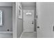 Welcoming foyer with tile flooring, a white front door, and natural light at 1094 Amber Sw Rdg, Lilburn, GA 30047