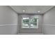 Clean and bright living room featuring a large window with beautiful outdoor views at 1094 Amber Sw Rdg, Lilburn, GA 30047