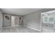 Living Room showcasing wood flooring, gray walls, and an open layout connecting to the kitchen at 1094 Amber Sw Rdg, Lilburn, GA 30047
