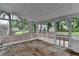 Screened patio with view of treed backyard at 1094 Amber Sw Rdg, Lilburn, GA 30047