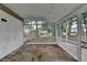 View of the screened porch with white trim and painted brick adjacent to outdoor living at 1094 Amber Sw Rdg, Lilburn, GA 30047