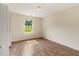 Bedroom with lots of natural light that offers a tranquil retreat with wood floors and neutral walls at 131 Tye St, Stockbridge, GA 30281