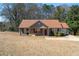 Charming single-story home with red brick accents, a cozy front porch, and a well-maintained lawn at 131 Tye St, Stockbridge, GA 30281