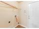 The dedicated laundry room provides convenience with utility hookups and storage shelving at 131 Tye St, Stockbridge, GA 30281