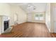 Inviting living room features a fireplace, wood floors, and ample natural light from a large window at 131 Tye St, Stockbridge, GA 30281