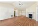 Bright living room with fireplace, vaulted ceiling, and wood floors provides a welcoming atmosphere at 131 Tye St, Stockbridge, GA 30281