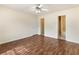 The bedroom features wood floors and access to an attached bathroom, offering privacy and convenience at 131 Tye St, Stockbridge, GA 30281