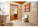Bathroom adjacent to main bedroom is finished with ceramic tiles at 360 Parr Farm Rd, Covington, GA 30016