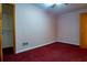 Bedroom with pink walls, red carpeting, ceiling fan, and closet space at 360 Parr Farm Rd, Covington, GA 30016