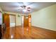 Spacious bedroom with hardwood floors and a ceiling fan at 360 Parr Farm Rd, Covington, GA 30016