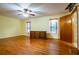Bedroom with hardwood floors, natural light, and ensuite bath at 360 Parr Farm Rd, Covington, GA 30016