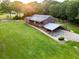 Expansive property with a well-maintained lawn, convenient carport, and charming ranch-style home at 360 Parr Farm Rd, Covington, GA 30016