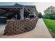 Multi-level exterior with brick retaining wall, carport and upper porch at 360 Parr Farm Rd, Covington, GA 30016