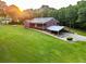 Beautiful home with spacious lawn, carport, and mature trees offering privacy and a country feel at 360 Parr Farm Rd, Covington, GA 30016