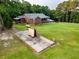 Aerial view of a brick home with a covered porch and a large, expansive yard at 360 Parr Farm Rd, Covington, GA 30016