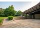 Spacious garage with an attached carport for added parking and storage space, surrounded by lush greenery at 360 Parr Farm Rd, Covington, GA 30016