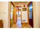 The hallway features tiled floors and views into an adjacent bathroom and rooms beyond at 360 Parr Farm Rd, Covington, GA 30016