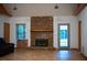 Living room featuring a stone fireplace, large windows, and tile floors at 360 Parr Farm Rd, Covington, GA 30016