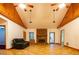 Bright living room with stone fireplace, large windows, and tile flooring at 360 Parr Farm Rd, Covington, GA 30016