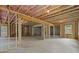 Bright unfinished basement with natural light and wood framing at 6120 Hutchins Dr, Buford, GA 30518