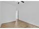 Bright bedroom featuring hardwood floors and a ceiling fan, offering a simple and clean aesthetic at 6120 Hutchins Dr, Buford, GA 30518