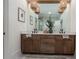 Bathroom featuring dual sinks, wood cabinets, and modern lighting at 1168 Mado Loop, Chattahoochee Hills, GA 30268