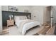 Cozy bedroom features stylish wall accents, neutral tones, and natural light, creating a relaxing atmosphere at 1168 Mado Loop, Chattahoochee Hills, GA 30268