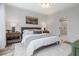 Bright bedroom with ensuite bathroom, neutral décor, and wood floors at 1168 Mado Loop, Chattahoochee Hills, GA 30268