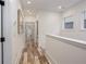 Hallway with recessed lighting, light gray walls, and wood-look flooring at 1168 Mado Loop, Chattahoochee Hills, GA 30268
