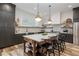 Contemporary kitchen boasting an island with bar seating, stainless steel appliances, and custom cabinetry at 1168 Mado Loop, Chattahoochee Hills, GA 30268