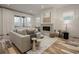 Inviting living room with a comfortable couch, fireplace, and bright windows showcasing modern design at 1168 Mado Loop, Chattahoochee Hills, GA 30268