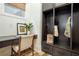 Mudroom with built-in storage cubbies, bench, and desk area for organization at 1168 Mado Loop, Chattahoochee Hills, GA 30268
