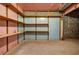 Unfinished basement space with shelving and cinder block walls at 3927 Airline Rd, Mcdonough, GA 30252