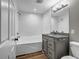 Bathroom with tub and shower featuring granite countertops and a large mirror at 3927 Airline Rd, Mcdonough, GA 30252