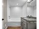 Bathroom with tub and shower featuring granite countertops and a large mirror at 3927 Airline Rd, Mcdonough, GA 30252