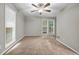 Spacious bedroom with neutral walls, carpet and large windows with natural light at 3927 Airline Rd, Mcdonough, GA 30252