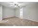 Neutral bedroom featuring plush carpeting, a ceiling fan, and a window for natural light at 3927 Airline Rd, Mcdonough, GA 30252