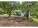 Quaint home with mature trees and professional landscaping at 3927 Airline Rd, Mcdonough, GA 30252