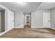Hallway with wood flooring and neutral paint colors at 3927 Airline Rd, Mcdonough, GA 30252