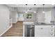 Modern kitchen with granite countertops, stainless steel appliances and open to the living area at 3927 Airline Rd, Mcdonough, GA 30252