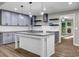 Updated kitchen with granite counters, stainless appliances, and an island open to the living space at 3927 Airline Rd, Mcdonough, GA 30252