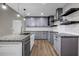 Renovated kitchen boasts granite countertops, new appliances, and ample cabinet space at 3927 Airline Rd, Mcdonough, GA 30252