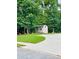 Backyard shed sits at the back of the property and features a gray exterior with white trim at 7052 Camp Falls Ct, Winston, GA 30187
