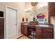 Bathroom featuring dual sinks with granite counters and a vanity area at 7052 Camp Falls Ct, Winston, GA 30187