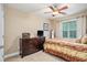 Cozy bedroom with a dresser and warm, inviting decor at 7052 Camp Falls Ct, Winston, GA 30187