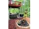 Outdoor living space showcasing a hot tub, furniture and elegant details at 7052 Camp Falls Ct, Winston, GA 30187